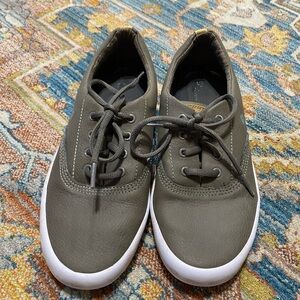 Gray leather sperry shoes.